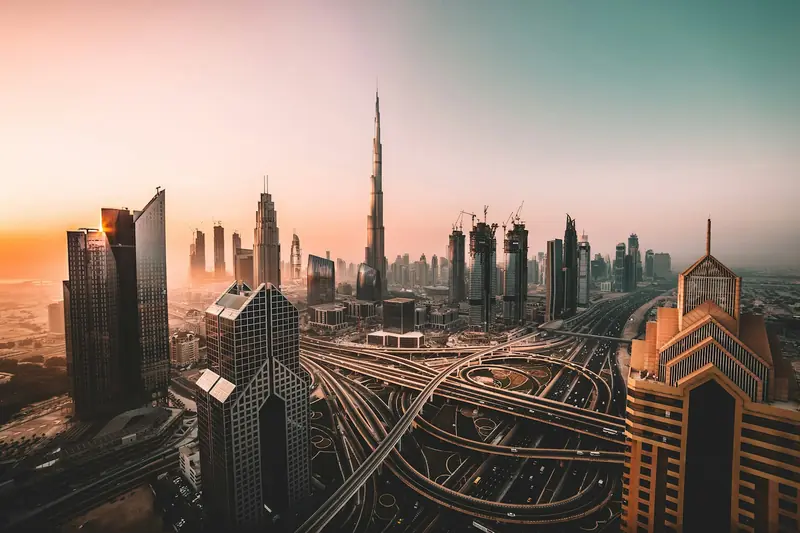 Dubai skyline at sunrise with Burj Khalifa above Downtown Dubai